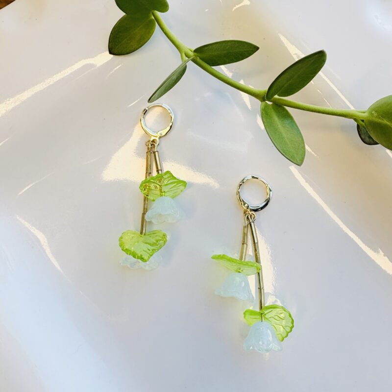 Anka Snider light blue flower earrings